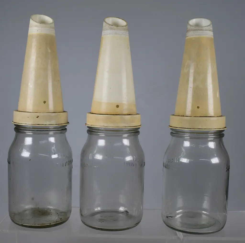 OIL BOTTLES AND STORAGE RACK Image 1++