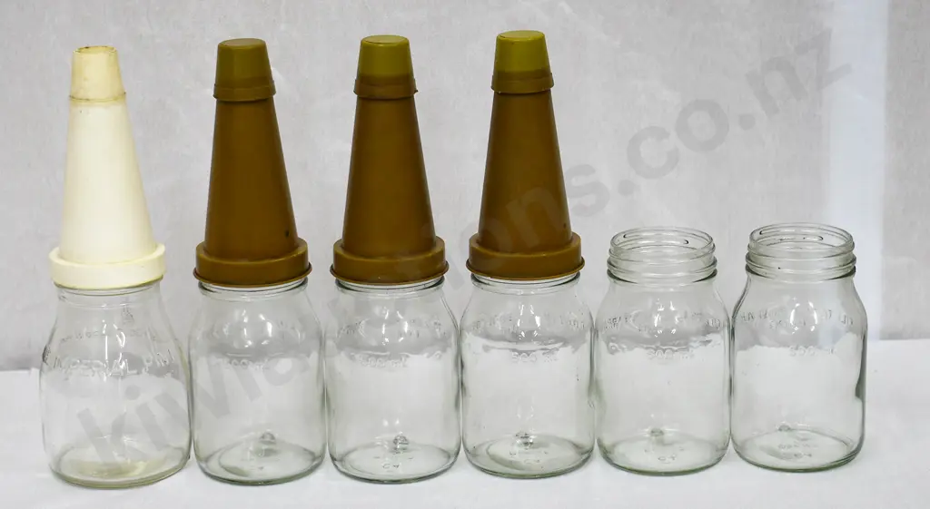 OIL BOTTLES AND STORAGE RACK Image 1++
